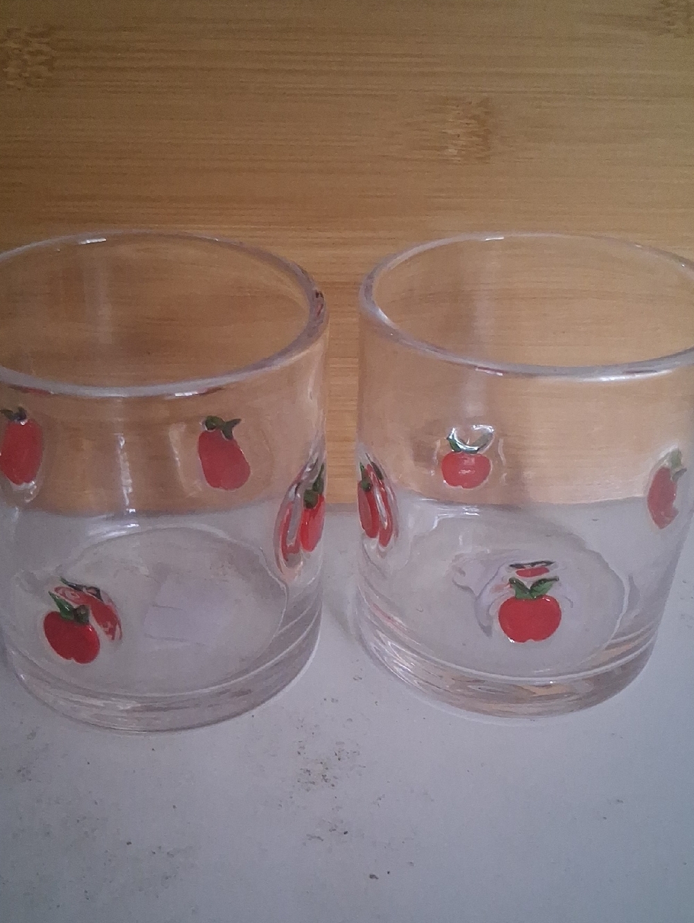 Crate & Barrel Pair of Clear  Tumblers with Red Apple Accents